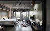 Modern home with Bedroom, Track Lighting, Bed, Pendant Lighting, Chair, and Concrete Floor. The themes of the five rooms often change, creating different experiences for travelers to look forward to on their next trip back. Photo 15 of Play Design Hotel