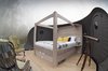 Modern home with Bedroom, Bed, and Chair. Underfloor heating and heated mattresses are the standard in both dome room offerings—the standard Forest Bubble Dome and the Premium Bubble Dome—that sleep two in a four-poster bed and connect to an ensuite bathroom. Photo 3 of Enchanting Bubble Domes in the Irish Woods