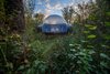 Modern home with Exterior and Dome RoofLine. International collective Dome Experience designed and built the bubble domes, with built-in wood paneling and a four-poster bed. Domes can be installed and operational within four to six weeks at sites with existing utility lines. The domes can also run off of off-grid power. Photo 7 of Enchanting Bubble Domes in the Irish Woods