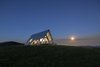 Modern home with Exterior, A-Frame RoofLine, Metal Roof Material, Wood Siding Material, and Cabin Building Type. Stargazing is easy thanks to the lack of light pollution. Photo 7 of Kimo Estate