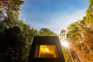 The timber exterior is stained to help the cabins blend in with the environment.