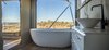 Modern home with Bath Room, Freestanding Tub, Medium Hardwood Floor, and Vessel Sink. The interior freestanding bath in the Uralla. Photo 10 of Sierra Escape