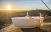 Modern home with Bath Room, Freestanding Tub, and Medium Hardwood Floor. Crafted for honeymooners, the Uralla tent boasts the amenities of the Dulili in addition to an outdoor freestanding bathtub, prime hilltop views, and complimentary champagne and treats. Photo 11 of Sierra Escape