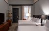 Modern home with Bedroom, Night Stands, Table Lighting, Floor Lighting, Bed, Lamps, and Carpet Floor. This accessible room is equipped with two queen-sized beds. Photo 10 of The Eliza Jane