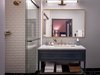 Modern home with Bath Room, Marble Counter, Porcelain Tile Floor, Enclosed Shower, Undermount Sink, Wall Lighting, and Subway Tile Wall. The elegant bathrooms are finished with white beveled subway tile, marble countertops and brass Kohler fixtures. Photo 6 of The Eliza Jane