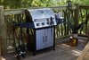 Modern home with Outdoor, Woodland, Wood Fences, Wall, Large Patio, Porch, Deck, and Trees. The hexagonal deck also features a classic five-burner gas grill to satisfy the guests' cookout needs. Photo 19 of Ravendere Retreats