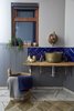 An old brass jam pan has been repurposed into the bathroom sink, while the tap is a reclaimed French copper kettle. Photo 10 of Ravendere Retreats modern home