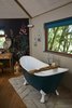 Modern home with Bath Room, Wall Lighting, Medium Hardwood Floor, and Freestanding Tub. The roll-top freestanding bath overlooks beautiful valley views. Photo 6 of Ravendere Retreats