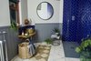 Modern home with Bath Room, Vessel Sink, Wood Counter, Open Shower, Painted Wood Floor, and Rug Floor. The downstairs bathroom features a waterfall shower. A glass shower enclosure (not pictured) has also been installed. Photo 9 of Ravendere Retreats