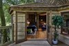 Modern home with Outdoor, Woodland, Trees, Wood Fences, Wall, and Large Patio, Porch, Deck. Glazed French Doors connect the deck with the living area. Photo 18 of Ravendere Retreats