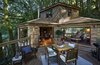 Modern home with Outdoor, Woodland, Trees, Large Patio, Porch, Deck, and Wood Fences, Wall. Large windows blur the boundaries between indoor and outdoor living. Photo of Ravendere Retreats