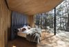 Modern home with Bedroom, Light Hardwood Floor, Bed, and Night Stands. Curved, full-height glazing erases the boundary between indoors and out. Photo 4 of Freycinet Lodge