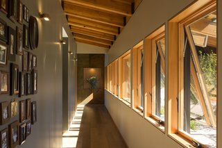 Here, the long gallery provides access to the two bedrooms and open-plan living space.
