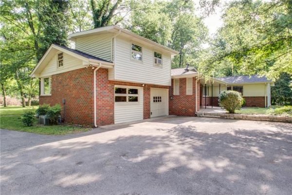 Before: located in the West Meade neighborhood, the original house featured a red-brick exterior with cream-colored, hardboard banding.