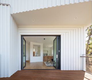 Folding aluminum-framed glass doors facilitate a seamless transition between indoors and out.

