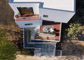 "With each offset, the adjacent roof becomes a balcony, expanding interior spaces to the exterior at every floor," explain the architects. "These indoor-outdoor spaces have varied orientations with unique and unobstructed views to the San Gabriel mountains."