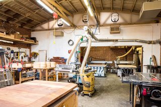 A look inside Knowhow Shop's fabrication and machine space. Moving the office out of this space freed up room for a second CNC router.