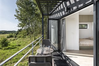 Folding glass doors blur the boundaries between the indoors and out.