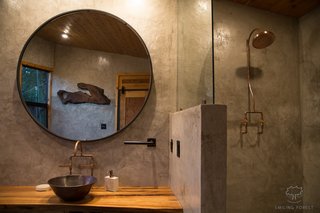 The floors and walls have been built from polished concrete, while the counters are reclaimed American Elm.