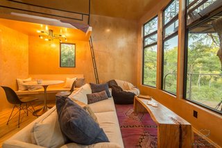 The interiors are furnished with selections from the likes of West Elm and Four Hands. ArtisTree also custom-crafted some of the furniture.