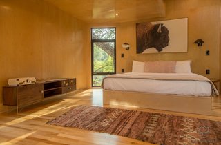 The light-filled bedroom comes with a cozy king-size bed, as well as air conditioning and heating.
