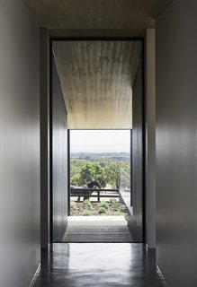 Corridors run the length of the pavilions and are bookended with full-height glazed openings overlooking views of farm life.