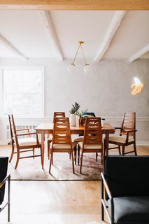 The pendant light is by Pepe & Carols while the banana light is from Urban Outfitters. The table and chairs were a thrifted find as was the antique rug.