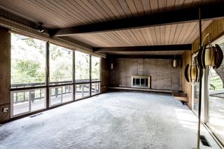 The old living room was dominated by a muddle of brown colors.