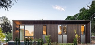 Charred using the traditional Japanese wood preservation technique called shou sugi ban, the locally sourced cedar planks provide the home with a handsome, low-maintenance facade.