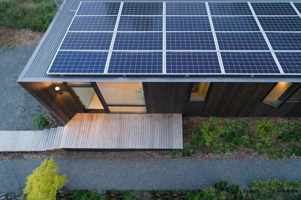 Angled towards the sun, the solar panels meet all of the studio's energy needs with enough energy left over to power the adjacent house.