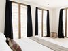 Modern home with Bedroom, Bed, Recessed Lighting, and Concrete Floor. Floor-to-ceiling slatted wooden shutters flood the rooms with natural light. Photo 13 of Casa Pueblo Tulum