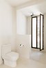 Modern home with Bath Room, Open Shower, Two Piece Toilet, Limestone Floor, and Full Shower. The light-filled en suite bathrooms feature hand-sculpted, polished concrete sinks and walk-in rain showers. Photo 3 of Casa Pueblo Tulum