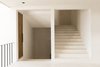 Modern home with Staircase and Stone Tread. Bathed in soft light, the minimalist plaster walls give the hotel an elegant feel. Photo 6 of Casa Pueblo Tulum