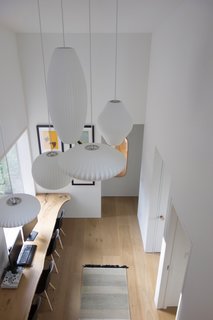 Nelson bubble lamps hang above the kids' gaming station below.