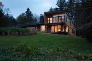 Located on the second floor of the new extension, the master suite takes advantage of long views down the length of Candlewood Lake.