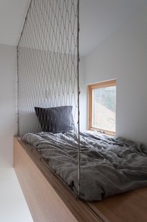 The sloped roof in the new addition created space for high-lofted bunks in the bunk room.