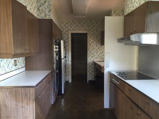 Before: The former kitchen felt constrained in size and cordoned off from the dining and living areas.