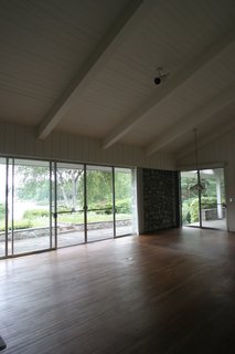 Before: The floors in the living area sagged and needed to be replaced. All windows and sliding glass windows were upgraded in the renovation.