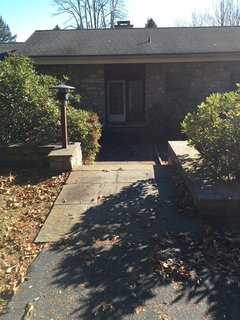 Before: The original home's asphalt shingle roof was damaged and needed to be replaced.