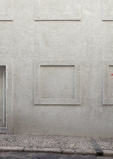 In addition to gleaning inspiration from Irving Gill's Dodge House, the Dodged House also derives its name from its opaque street facade. "As its name indicates, the Dodged house makes an attempt to elude, to trick, an actual state of a certain architecture in Lisbon," the architect says.