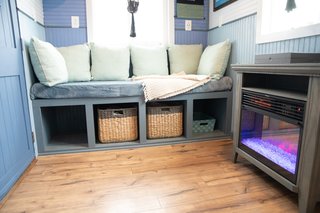 An electric fireplace heater from Walmart adds a touch of coziness and warmth to the living area.