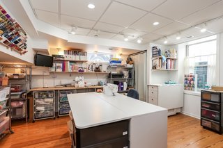 The sewing room is in the basement. The floors are laminate.