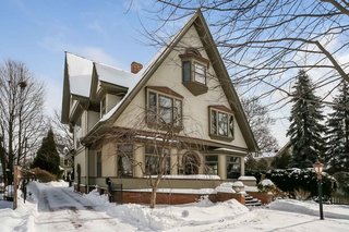 Punctuated with dormers of various sizes and sharply pitched roofs, this eye-catching home is a landmark in the La Grange neighborhood.