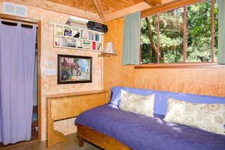The couch can be used as an additional bed for a third guest.