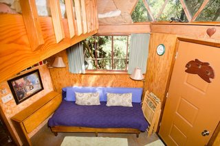 The main floor, nicknamed the "Pentagon," comes with a couch, fold-out table, and a kitchenette with a few basic appliances and complimentary snacks.
