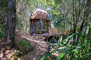 Tucked away on a 10-acre forested property, the tiny cabin overlooks views of the redwoods. In celebration of the Mushroom Dome Cabin’s popularity, Airbnb created a replica of the cabin at their headquarters.