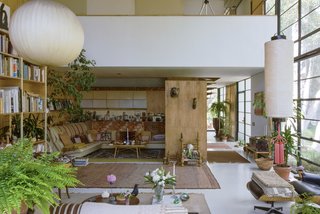 A view of the living room, looking north. The overhanging balcony belongs to the bedroom area.