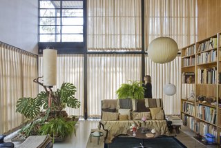 Curtains are drawn to reduce light exposure and damage to the collections and contents.