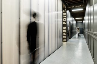 To make the long corridor more inviting, polycarbonate walls were installed to brighten up the space while preserving a sense of privacy.