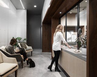 The space is defined by white oak, glass, polycarbonate walls and bronze accents.